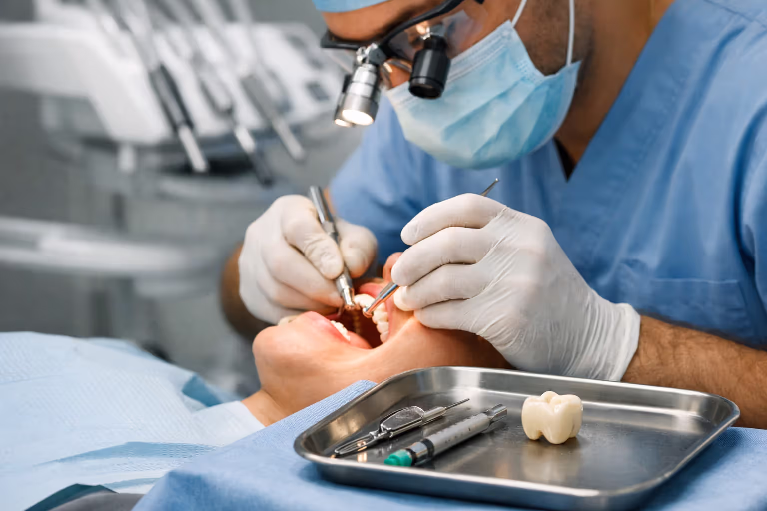 Dentist preparing or placing a dental crown during treatment