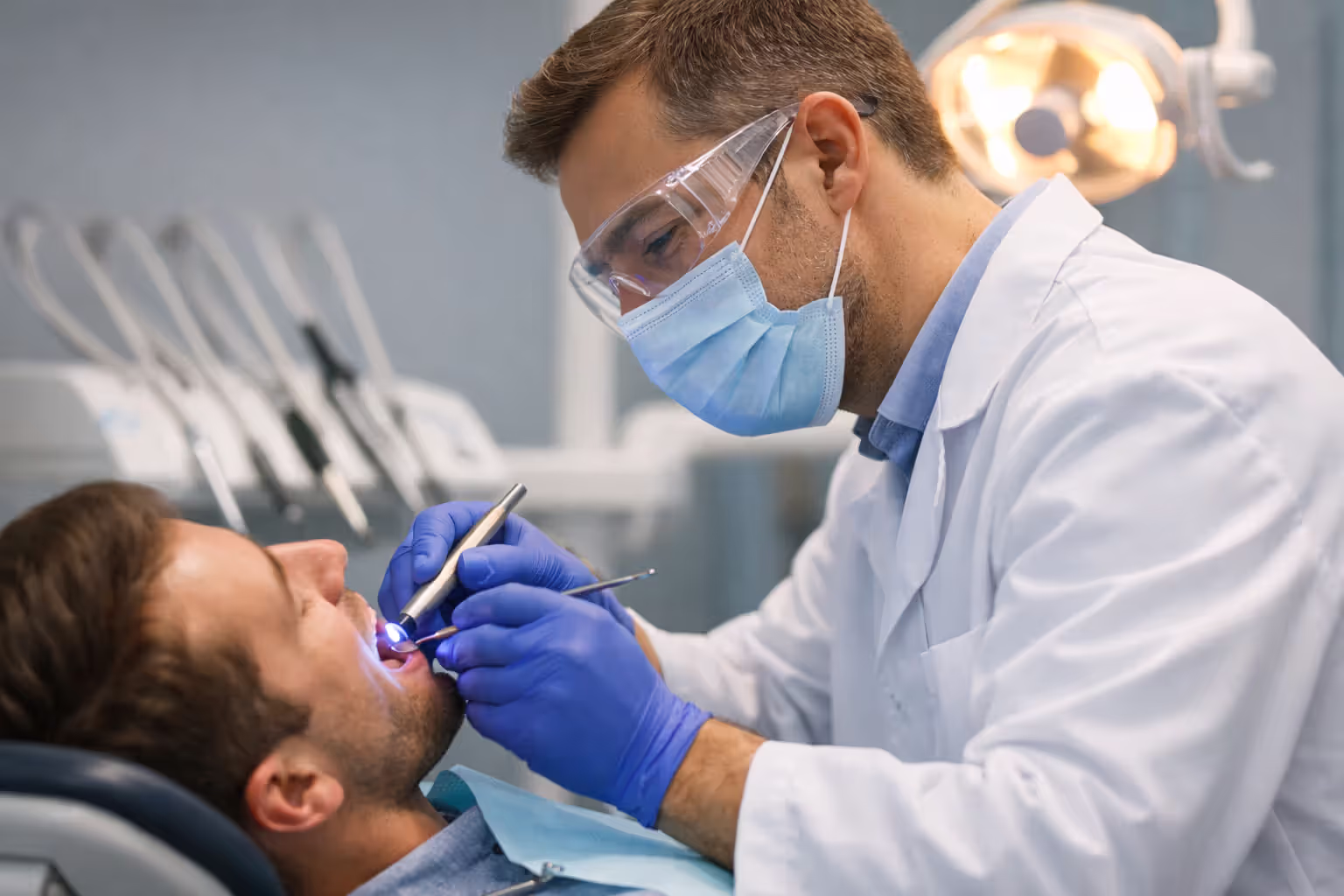 Dentist performing a dental filling procedure on a patient in a clinic