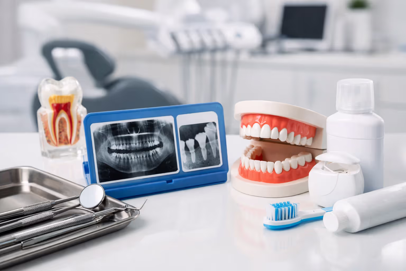 Dental tools and treatment planning materials representing different insured dental procedures