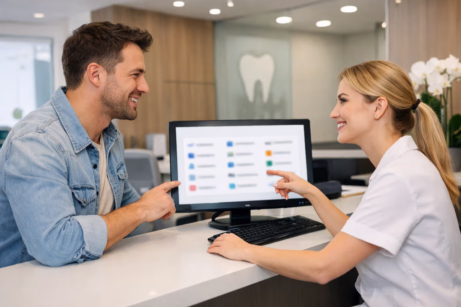 Patient checking dental insurance network information at clinic reception